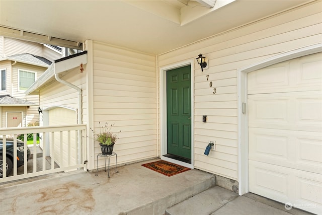 property entrance featuring a garage