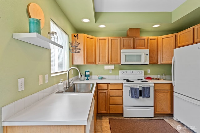 kitchen featuring sink and white appliances