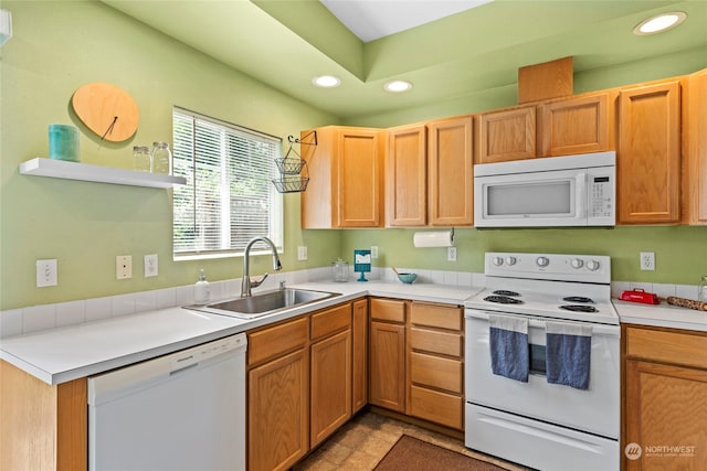 kitchen with sink and white appliances