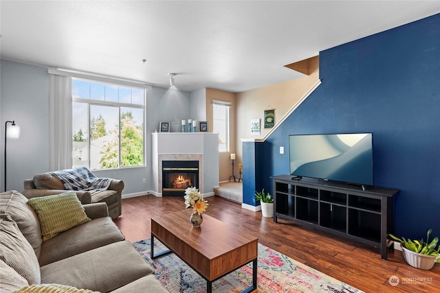 living room with dark hardwood / wood-style flooring