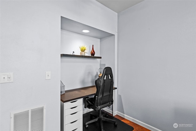 office with wood-type flooring