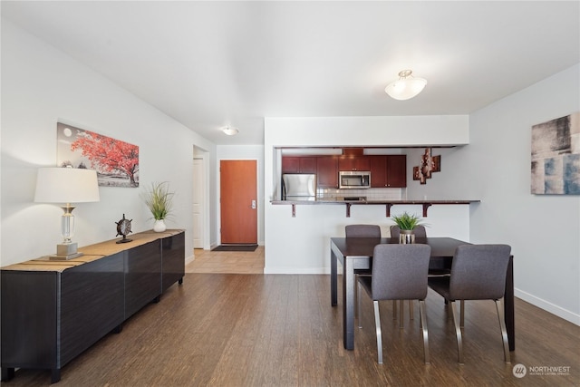 dining room featuring wood-type flooring