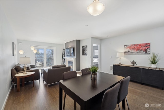 dining space featuring dark wood-type flooring