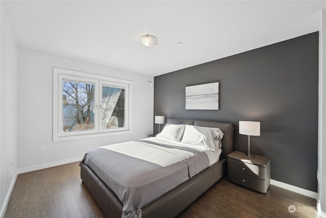 bedroom featuring dark hardwood / wood-style floors