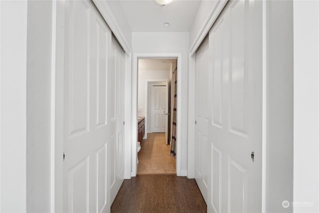 hall with dark hardwood / wood-style flooring