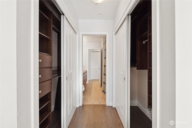 hallway featuring hardwood / wood-style flooring