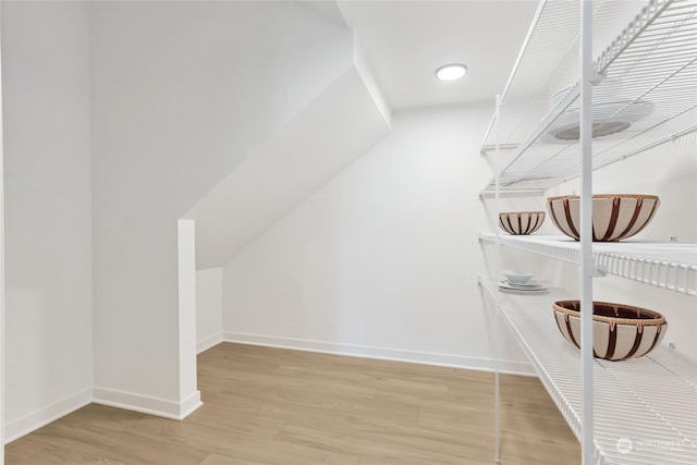 spacious closet with light hardwood / wood-style floors