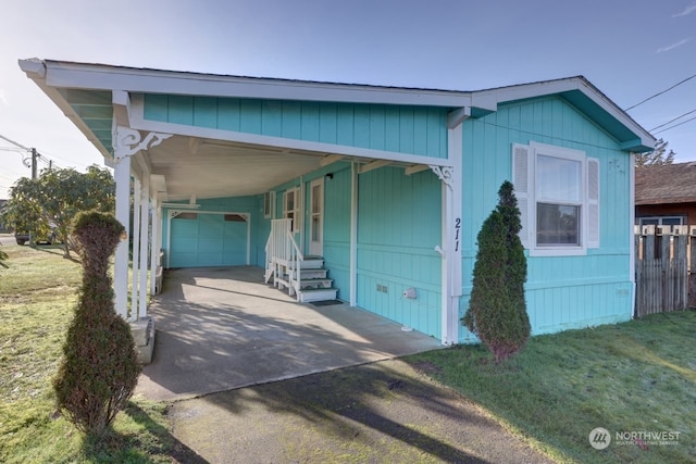 211 NE 7th St, Long Beach, WA 98631 - view of front of house featuring a garage, a front yard, and a carport