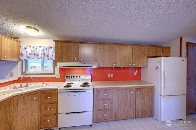 kitchen featuring ventilation hood, tasteful backsplash, sink, white appliances, and a textured ceiling