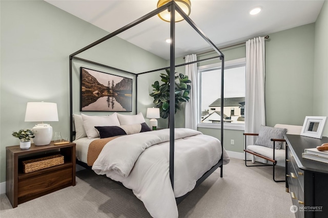 bedroom featuring light carpet