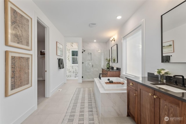 bathroom featuring tile patterned floors, vanity, and independent shower and bath