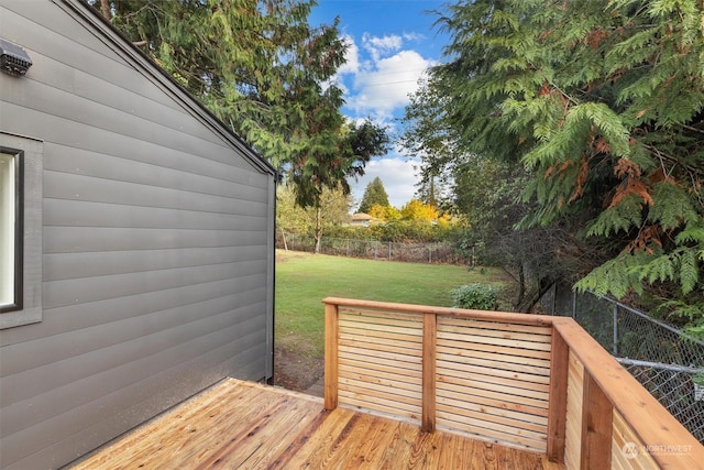 wooden deck with a lawn