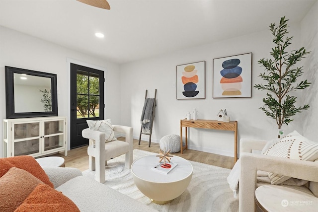 living room with light hardwood / wood-style flooring