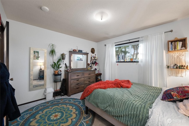 carpeted bedroom with a textured ceiling