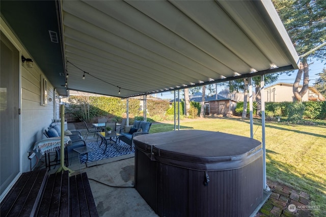 view of patio with a hot tub