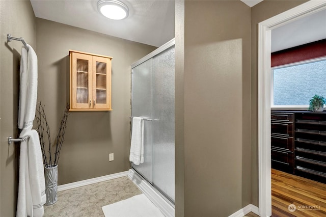 bathroom featuring an enclosed shower