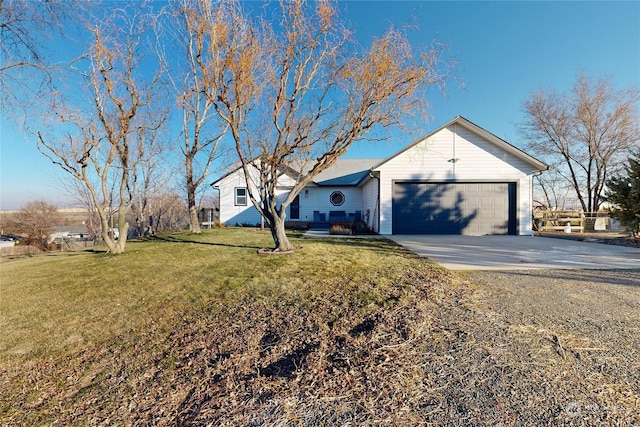 single story home featuring driveway, a garage, and a front lawn