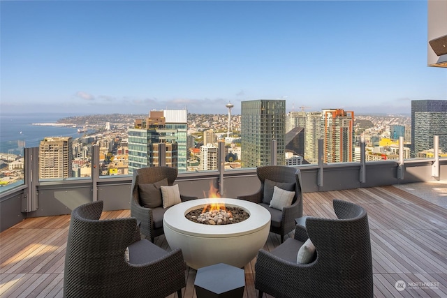 wooden terrace with a fire pit