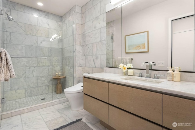 bathroom featuring walk in shower, vanity, and toilet