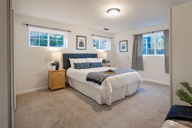 bedroom featuring light colored carpet