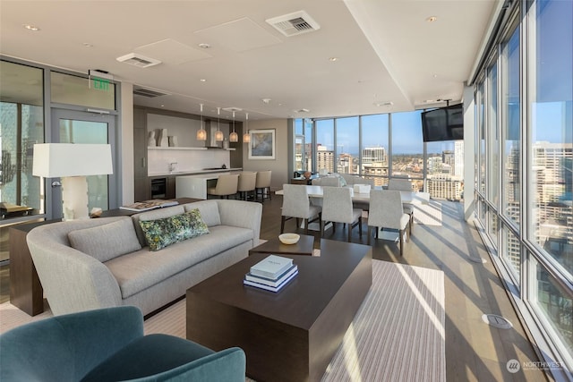 living room with wine cooler and a wall of windows