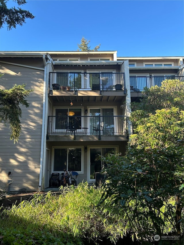 back of house with a balcony