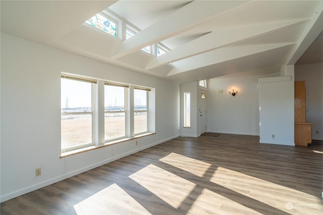 unfurnished room with lofted ceiling and dark hardwood / wood-style floors