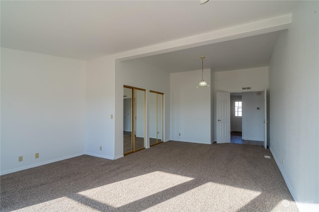 interior space featuring carpet and two closets