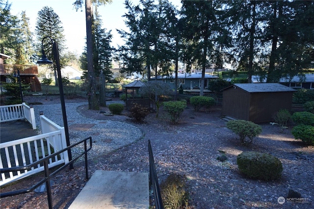 view of yard featuring a gazebo and a storage unit