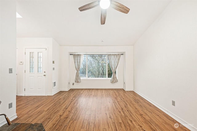 entrance foyer with ceiling fan and light hardwood / wood-style floors