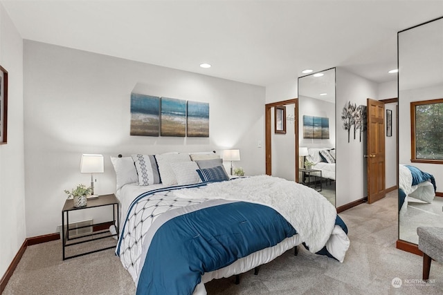 bedroom featuring light carpet