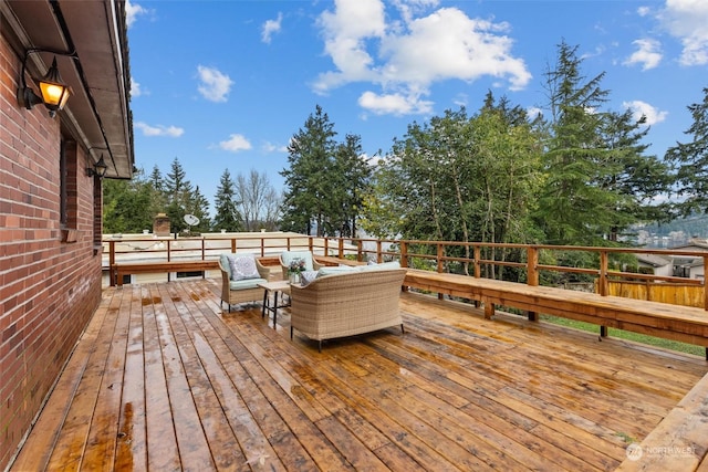 wooden terrace featuring an outdoor hangout area