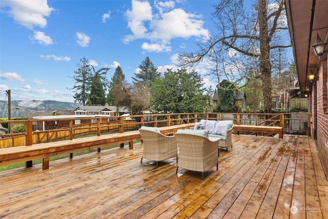 deck with a mountain view and an outdoor hangout area