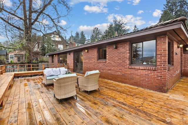 wooden terrace with outdoor lounge area