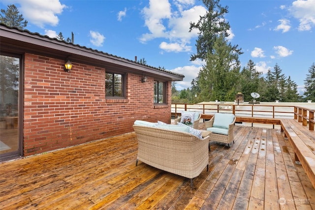 wooden terrace featuring an outdoor hangout area