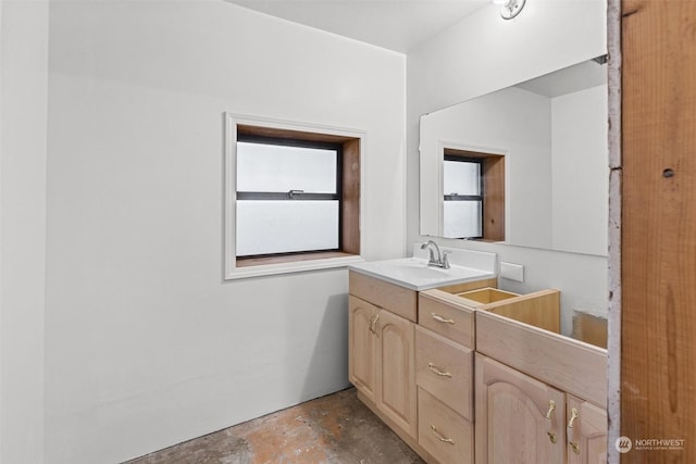 bathroom with vanity and concrete floors