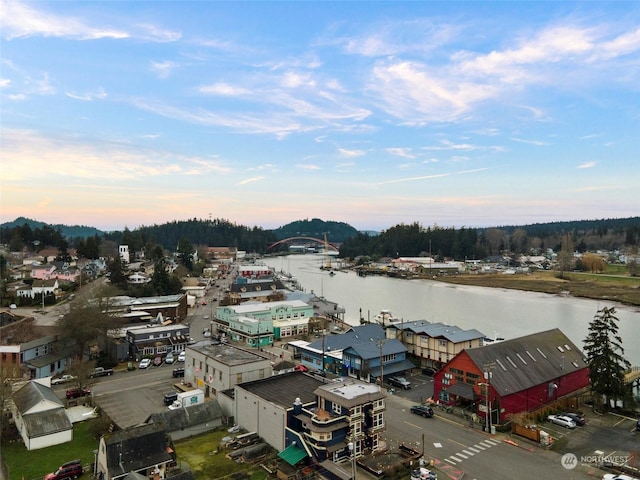 aerial view at dusk with a water view