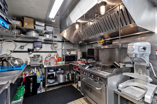 kitchen featuring light tile patterned floors and extractor fan