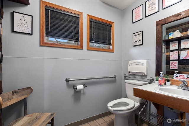 bathroom featuring tile patterned flooring and toilet