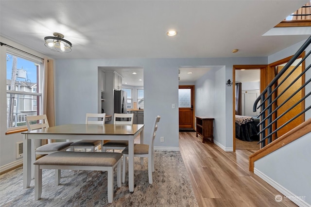 dining area with hardwood / wood-style flooring