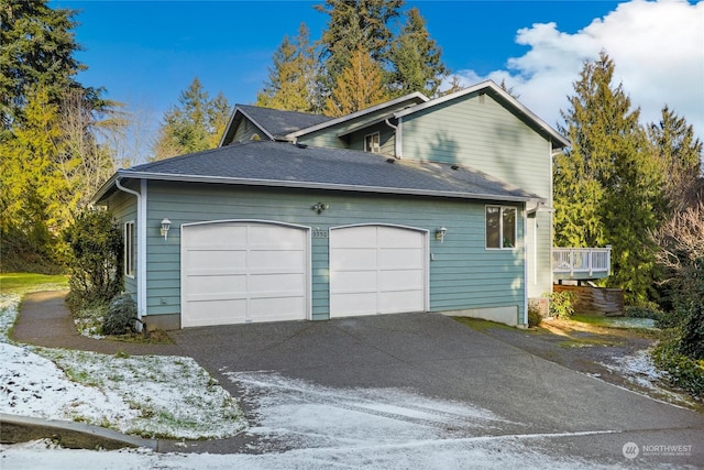 view of side of property with a garage