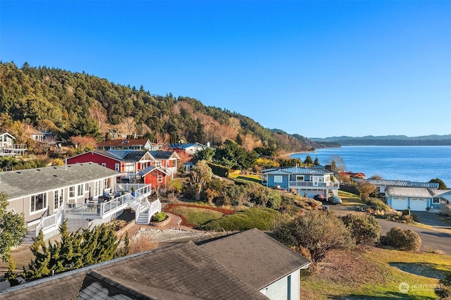 drone / aerial view featuring a water and mountain view