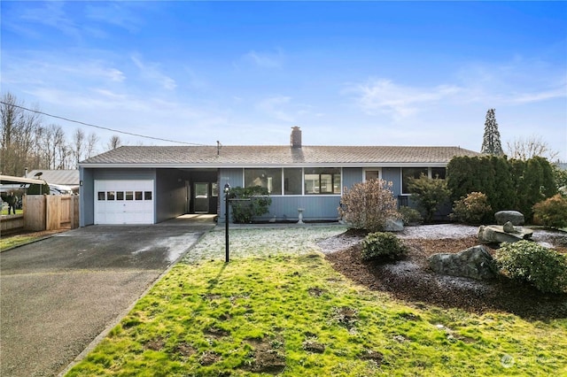 ranch-style house with a carport and a garage