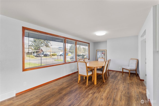 dining area featuring dark hardwood / wood-style floors