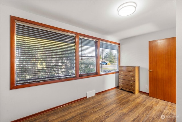 unfurnished bedroom with wood-type flooring