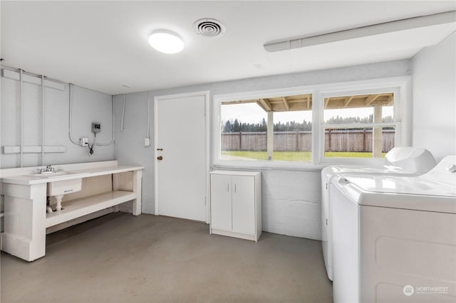 laundry area featuring washing machine and clothes dryer