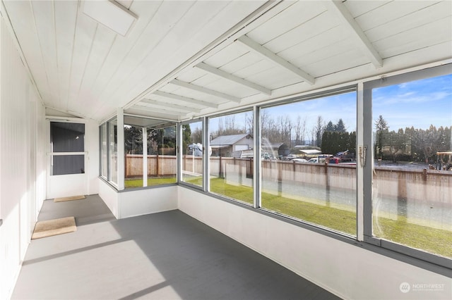 unfurnished sunroom with vaulted ceiling and a wealth of natural light