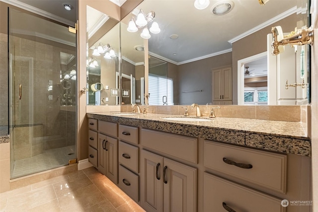 bathroom with crown molding, vanity, a shower with door, ceiling fan, and tile patterned flooring