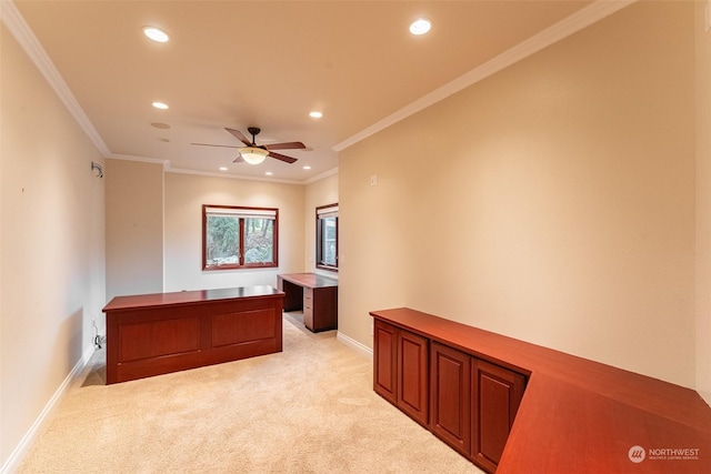 spare room featuring crown molding, light carpet, and ceiling fan