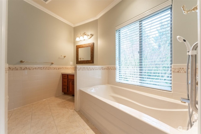 bathroom featuring a tub, tile walls, tile patterned flooring, vanity, and crown molding